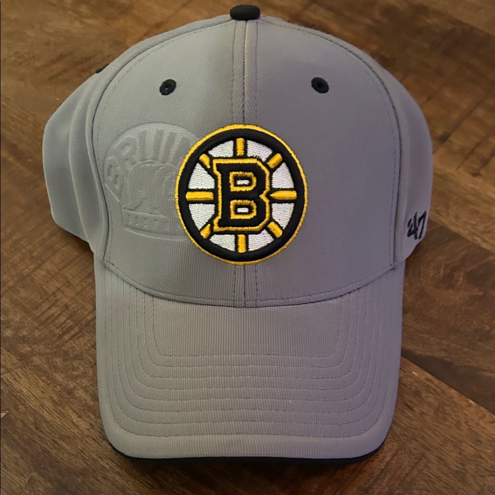 47 Gray Cap with Boston Bruins Emblem and Water Marked Retro Logo. S/M size.